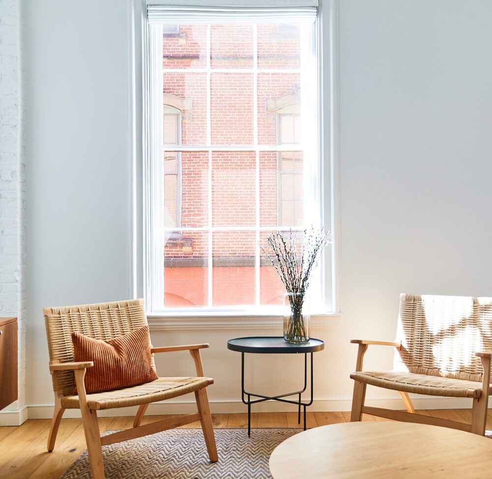 Enjoy a sun filled morning against a backdrop of historic red brick from the comfort of your Urban Home.